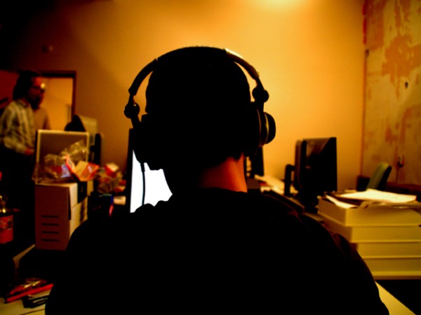 man listening to music at computer